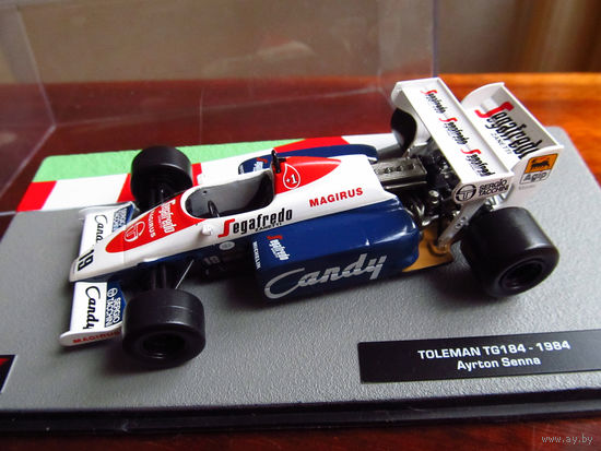 Модель автомобиля 1-43 Фомула 1 Formula 1 F1 Toleman TG 184 1984 Ayrton Senna В комплекте модель, бокс, журнал Состояние модель как новая журнал отличное