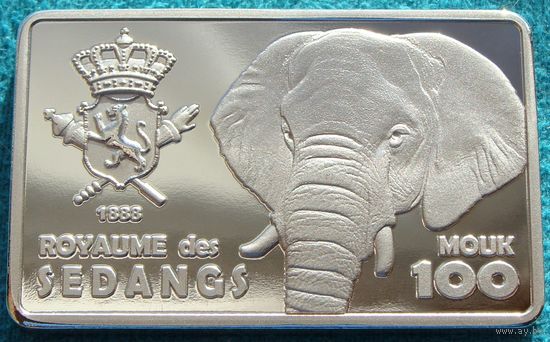 Королевство Седанг.  100 моук  2025 год  "Слоны"  UNUSUAL  Материал: Латунь, покрытая серебром  Тираж: 120 шт