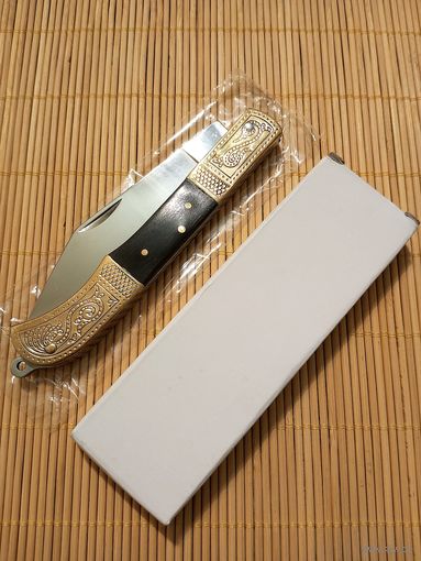 Нож золотистый новый складной