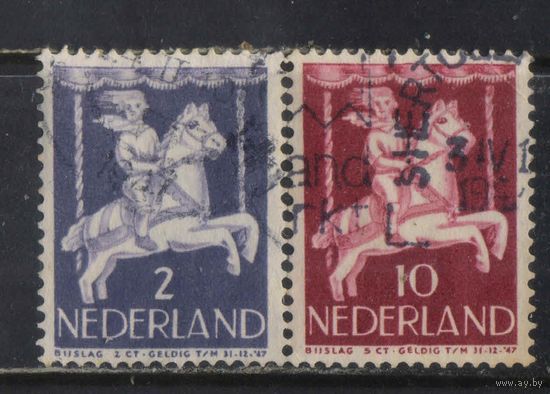 Нидерланды 1946 Вып Для детей Мальчик на карусели #472,475