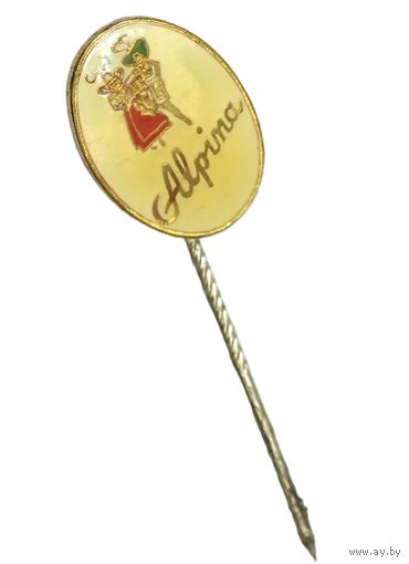 Винтажный значок  с надписью "Alpina".  Это коллекционный предмет, связанный с историей швейцарского часового производства