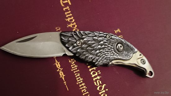 Нож брелок. Голова орла. Не точен, отличный брелок для ключей.