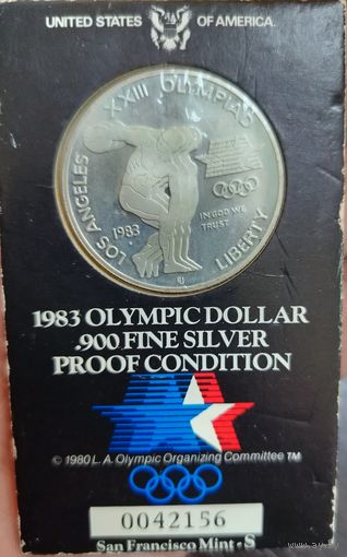 Коллекционная серебряная монета 1 доллар (Олимпийский доллар 1983 г ) в коинкарте вес монеты 26,73 грамма не вскрывалась .